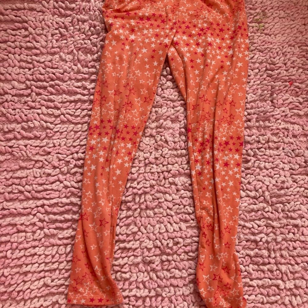 One step up orange stars leggings M